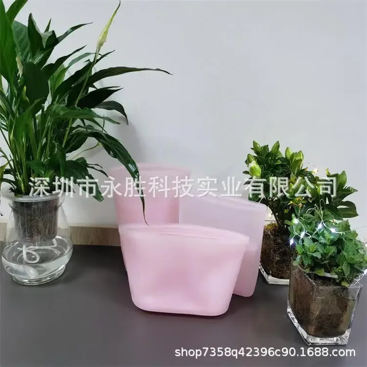 Set of pink silicone containers as an eco-friendly food storage solution for durable and reusable kitchen organization