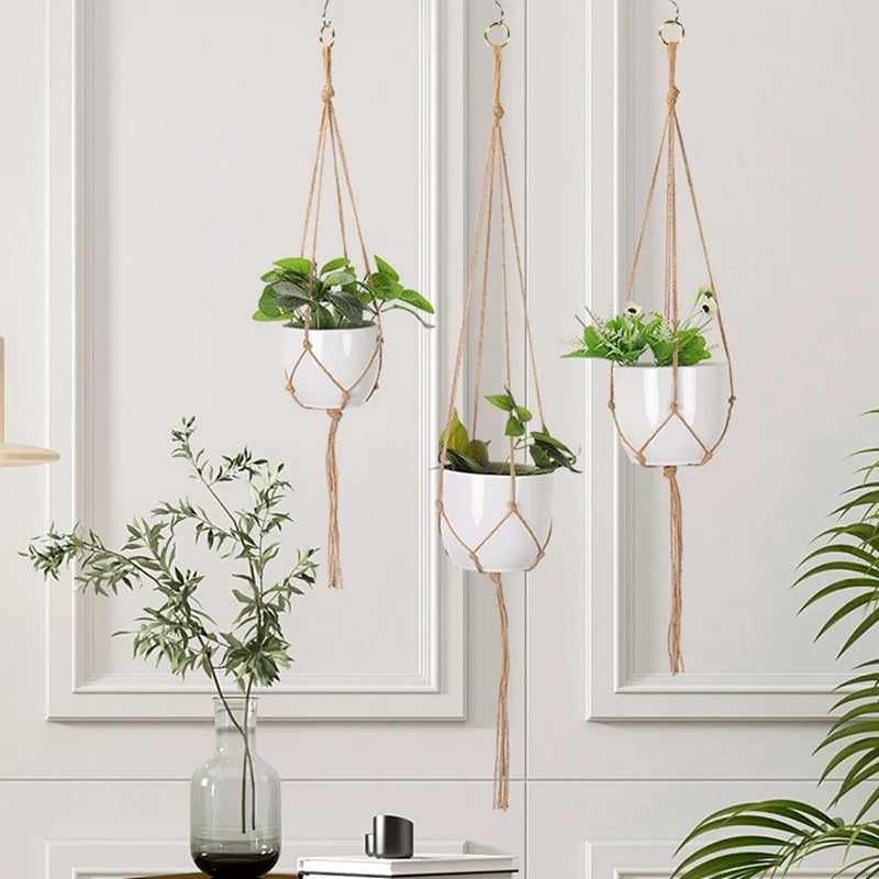 Set of three hanging planter baskets with stylish macrame designs featuring green plants for home decor